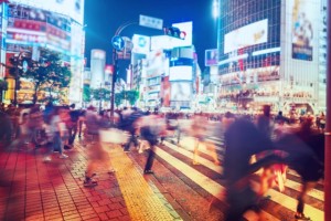 People and vehicles cross the famously busy Shibuya intersection in Tokyo