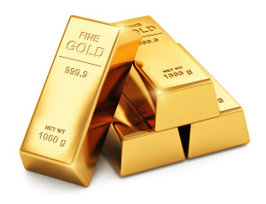 Stack of shiny gold ingots bars or bullions isolated on white background