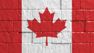 Brick wall with painted flag of Canada