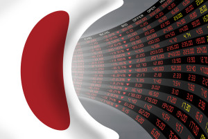 Flag of Japan with a large display of daily stock market price and quotations during economic stagnant period. The fate and mystery of Japan stock market tunnel/corridor concept.