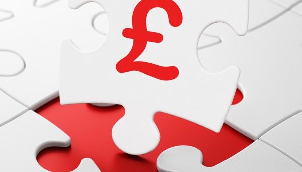 Pound surges higher, UK budget delayed