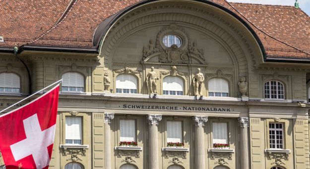 SNB opts for smaller hike but signals it isn’t done yet